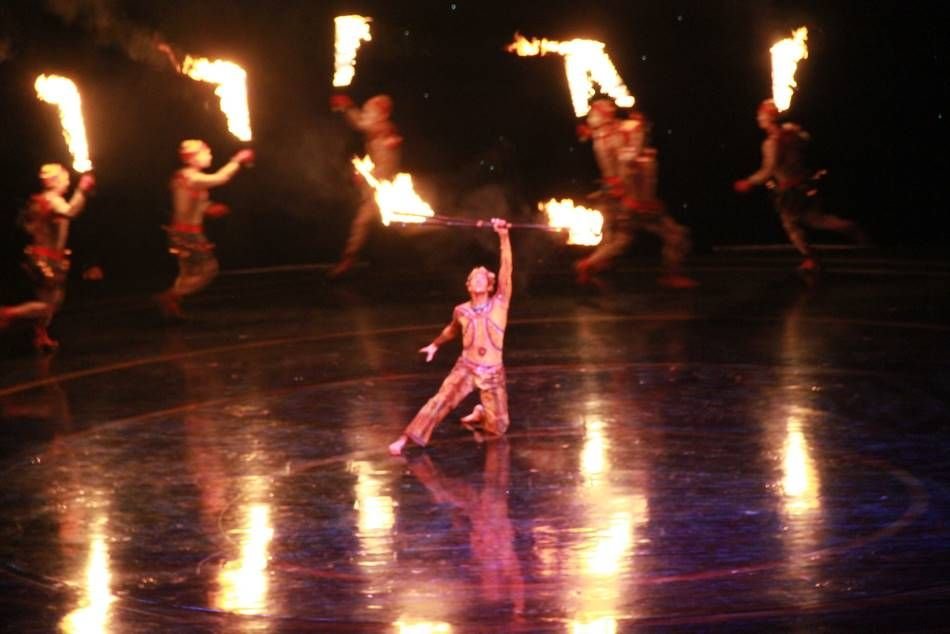 Fire performers on a large theatre stage